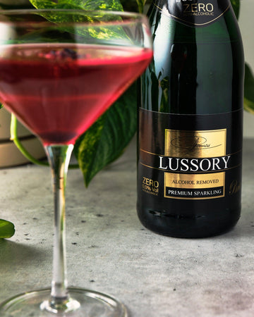 A Non-Alcoholic Hibiscus Spritzer next to Lussory Brut Non-Alcoholic Sparkling Wine