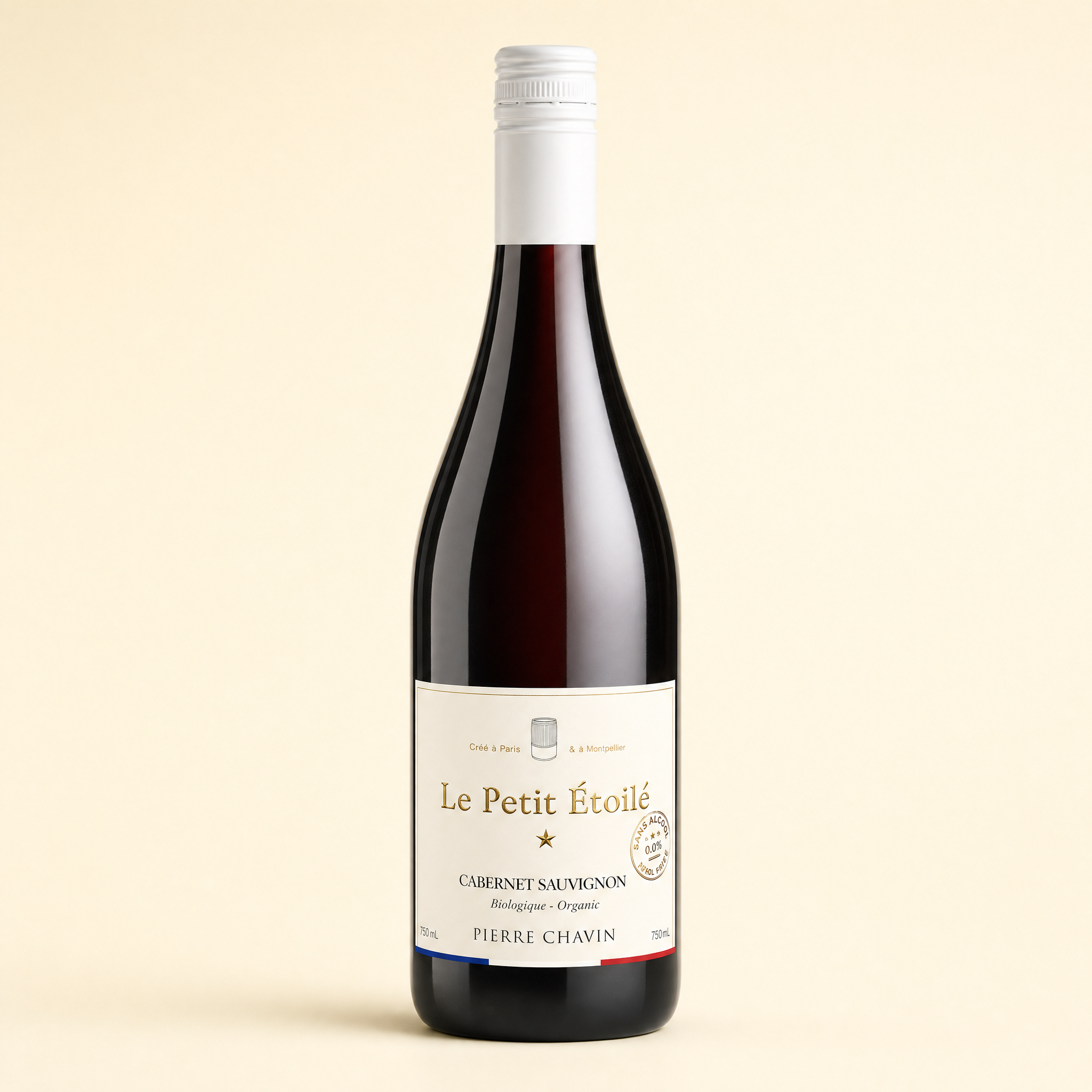 Le Petit Étoilé Cabernet Sauvignon 0.0% organic French non-alcoholic red wine bottle on a cream background