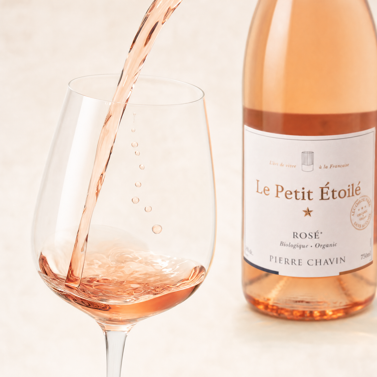 Le Petit Étoilé Rosé being poured — pale pink 0.0% still rosé