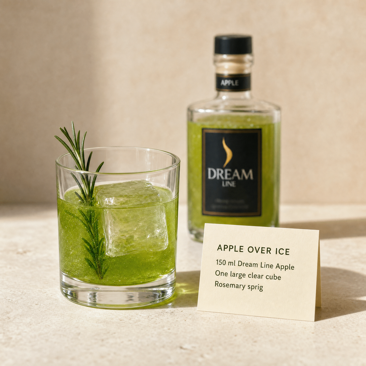 Dream Line Apple alcohol-free mocktail - Apple Over Ice serve with a large clear cube and rosemary
